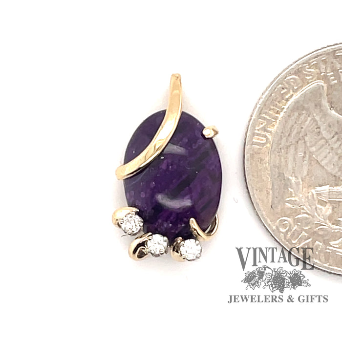 14 karat yellow gold Sugilite pendant with diamonds, shown with quarter for size reference