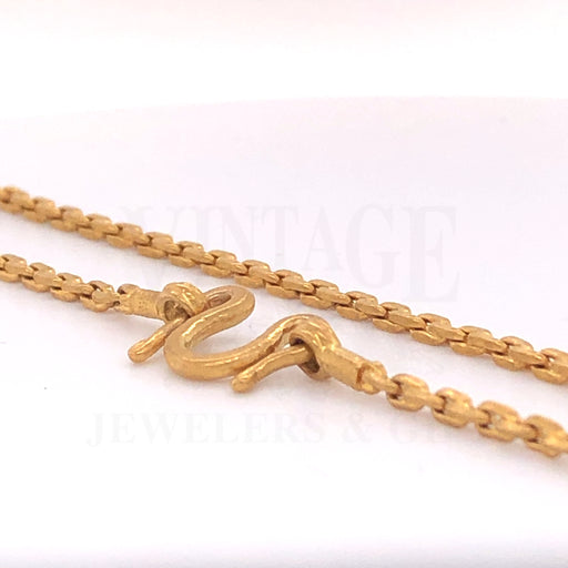 24 karat gold cable chain with "harp" style clasp