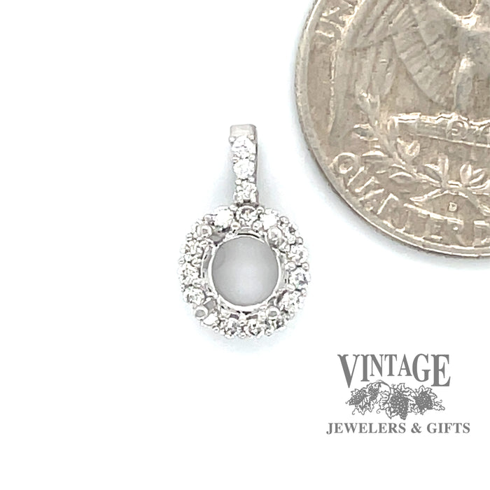 18 karat white gold .22ct diamond halo pendant mounting, shown with quarter for size reference
