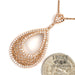 18 karat rose gold 1.29 carat total weight diamond pear shape pendant, next to quarter for scale