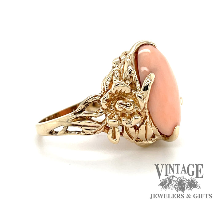 Angel skin coral ring in 14 karat gold floral design mounting, side view