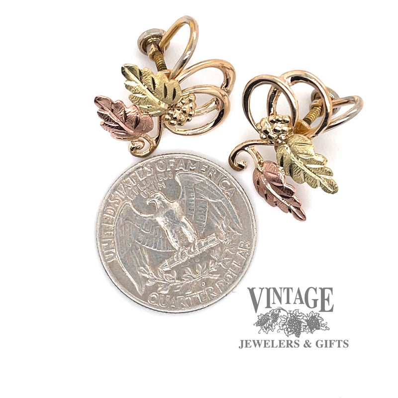Black Hills Gold earrings in 10ky and 12k pink and green gold quarter for scale