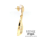 18 karat yellow gold doorknocker style drop earrings, side view