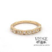 14 karat gold .15 carat toatl weight diamond wedding band, front view.