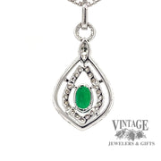 18 karat white gold natural emerald with diamond halo pendant, rear view
