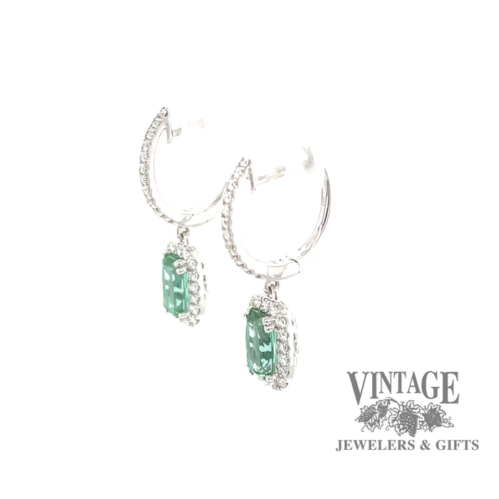 14 karat white gold diamond huggie drop earrings with stunning teal colored tourmalines, angled side view