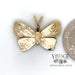Butterfly 14ky gold charm quarter for scale