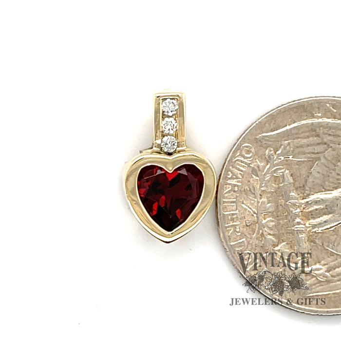 Heart shaped garnet and channel set pendant scale