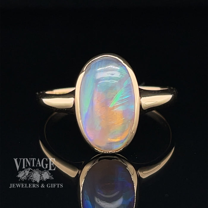 14 karat yellow gold oval bezel set opal contemporary ring