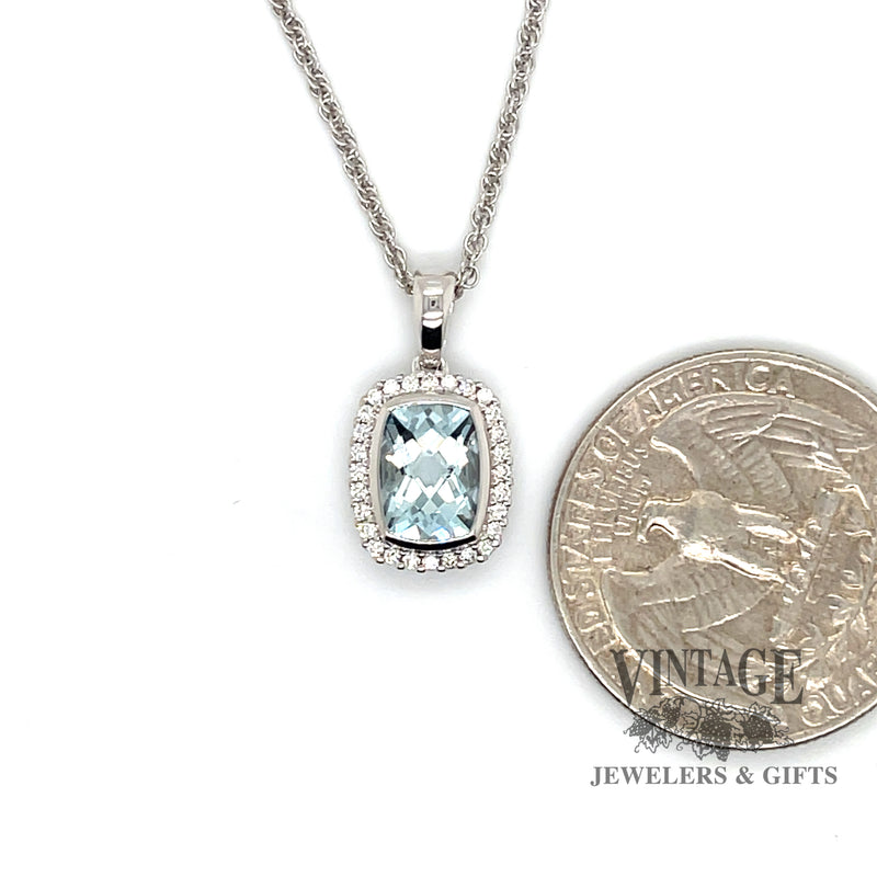 14 karat white gold 1.02ct aquamarine diamond halo pendant, shown with quarter for size reference