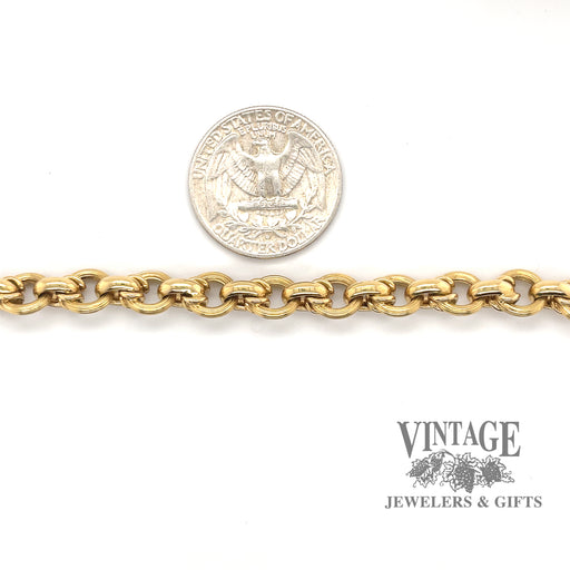 18 karat estate yellow gold fancy rolo style link bracelet, shown with quarter for size reference