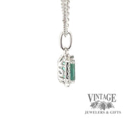 14 karat white gold .76ct Teal green tourmaline and diamond halo pendant, side view