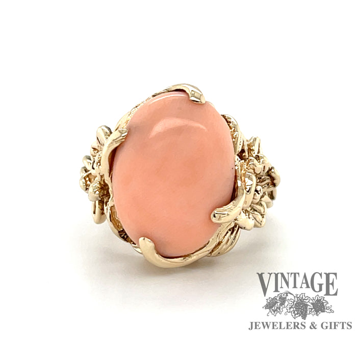 Angel skin coral ring in 14 karat gold floral design mounting, front view
