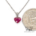 14 karat white gold 1.15ct heart shape natural ruby pendant, shown with quarter for size reference