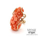 Floral carved coral 14k gold wrap ring, angled front view