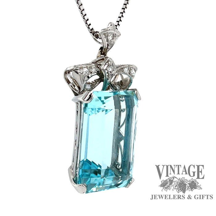 Aquamarine and diamond vintage platinum pendant, angled view