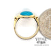18 karat yellow gold turquoise cabachon bezel set ring, shown with quarter for size reference