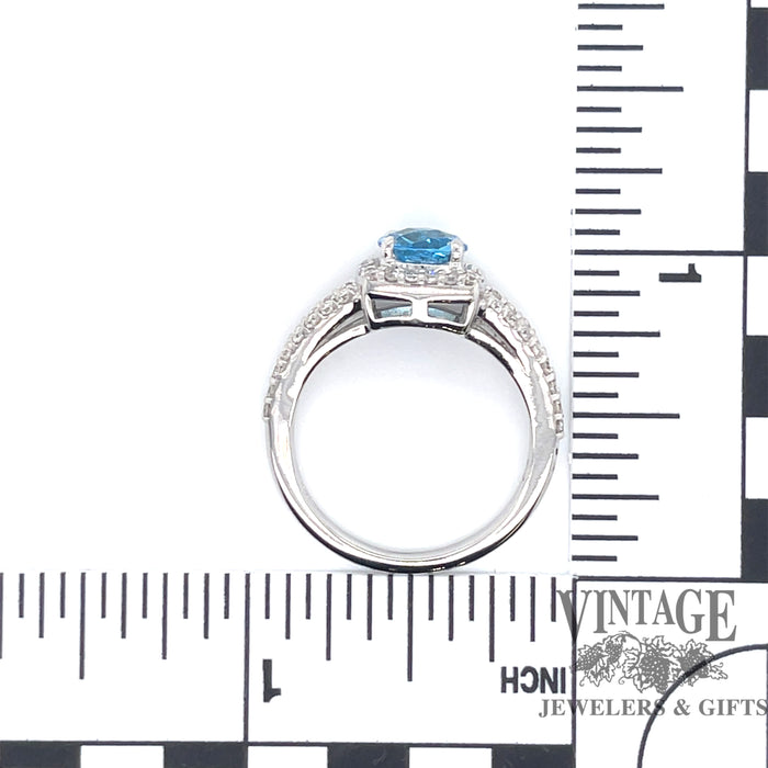 Blue topaz and diamond 14kw gold halo ring