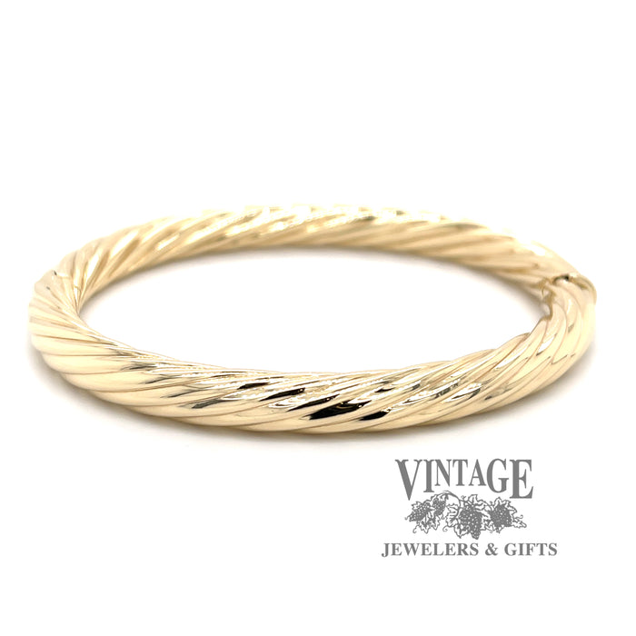 14 karat yellow gold twisted design, hinged bangle bracelet