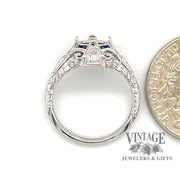 14 karat white gold hand engraved diamond and sapphire ring semi mount, side view through finger, shown with quarter for size reference
