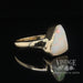 Natural white opal in 14ky gold ring angle