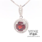14 karat white gold 1.5 carat garnet and diamond halo pendant, front view