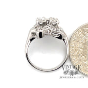 14 karat white gold .48ctw diamond Bouquet shaped ring, side view through finger shown with quarter for size reference