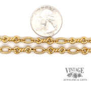 18 karat yellow gold 36.5" combination oval and twisted solid link chain next to quarter for size reference