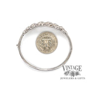 14 karat white gold 3 carat total weight baguette diamond hinged bangle bracelet, with quarter for size reference