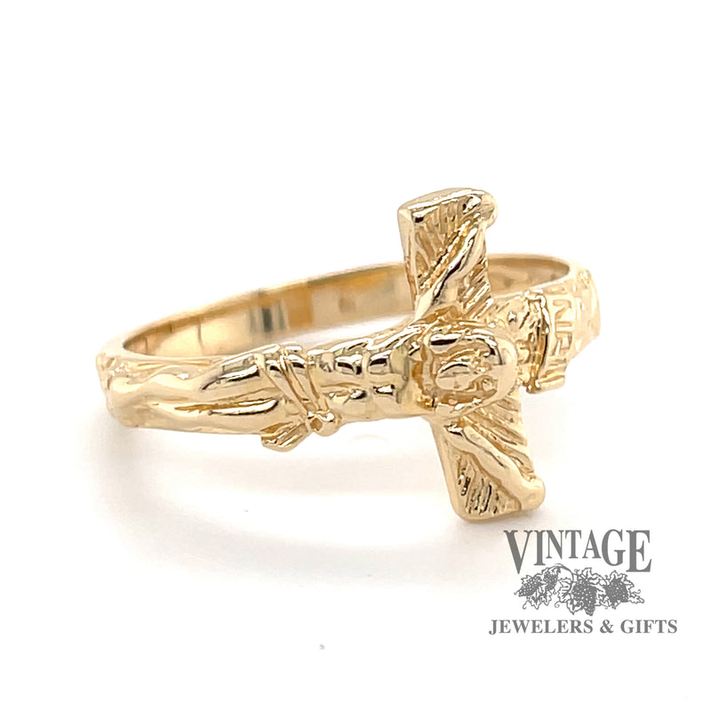 14 karat yellow gold crucifix ring, angled view