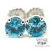 14 karat white gold 6 carat total weight round blue Zircon stud earrings, close up