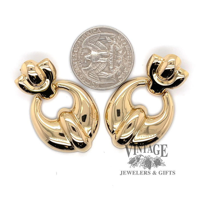 18 karat yellow gold doorknocker style drop earrings, shown with quarter for size reference