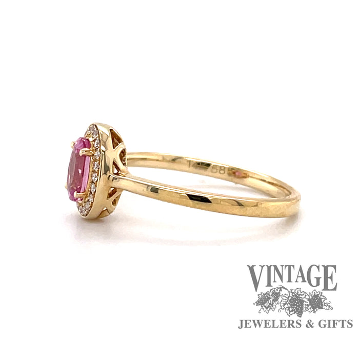 14 karat yellow gold oval pink sapphire and diamond halo ring, side view