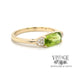 14 karat yellow gold East-West 1.32ct peridot and diamond ring, angled view
