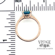 Blue zircon 14k rose gold embossed ring thru finger and scale