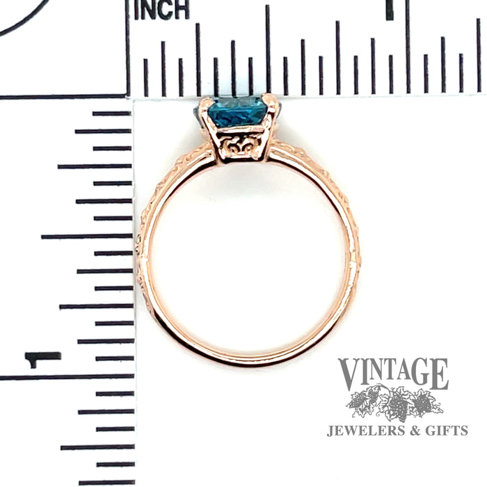 Blue zircon 14k rose gold embossed ring thru finger and scale