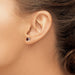 14 karat white gold 4 mm garnet stud earrings on model