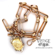 Vintage 14k gold pocket watch chain and mourning fob, showing engraved side of fob