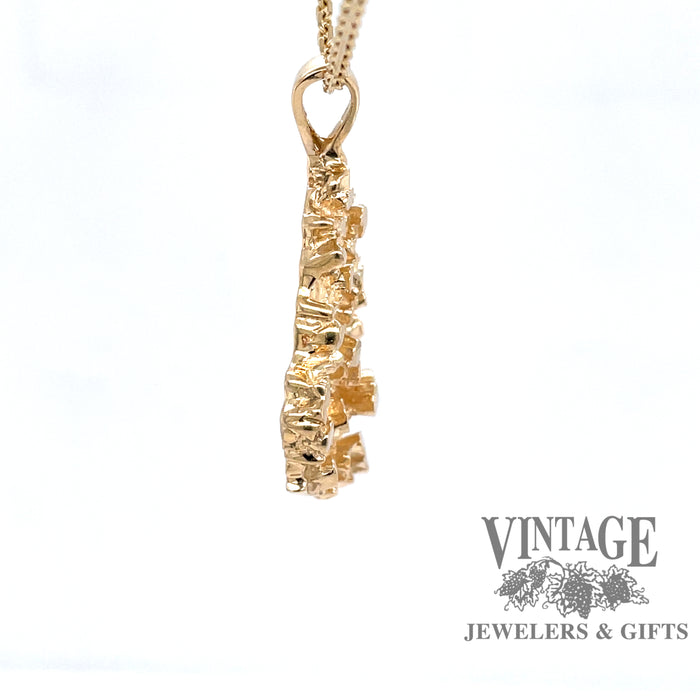 side view of 14 karat yellow gold cast nugget pendant