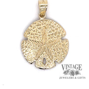 Mini sand dollar charm in 14ky gold
