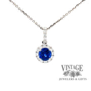 18k white gold Blue sapphire and diamond halo pendant, front view