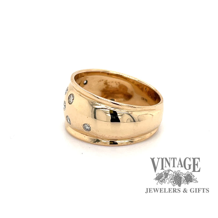 Wide flush set diamond yellow gold band