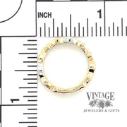 Garnet and diamond 14k two tone gold wave ring scale