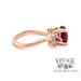 Side view of 14 karat rose gold natural red spinel and diamond ring