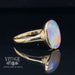 14 karat yellow gold oval bezel set opal contemporary ring, angled view