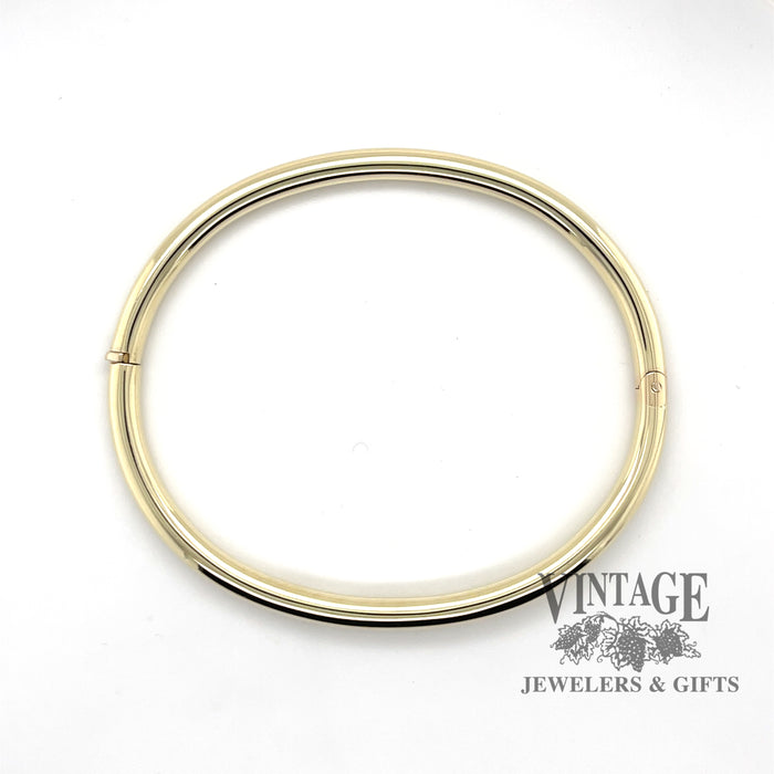 Classic 14ky gold polished hinged bangle bracelet