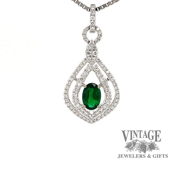 18 karat white gold natural emerald with  diamond halo pendant