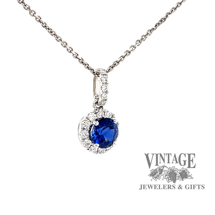 18k white gold Blue sapphire and diamond halo pendant, angled front/side view