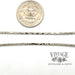 18" 14 karat white gold 2.3 mm cobra chain, shown with quarter for size reference