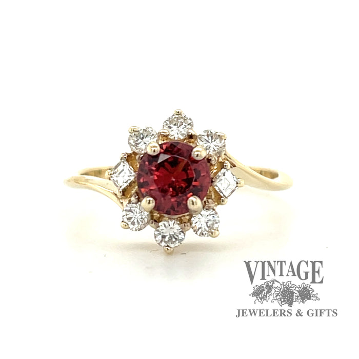Round pink sapphire ring in 14 karat yellow gold with halo diamonds